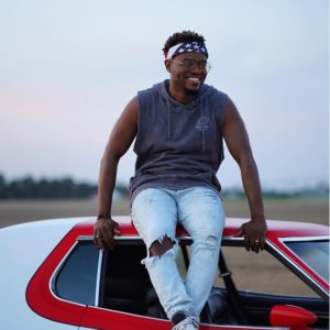 All things New by Travis Greene, Sitting on a red car